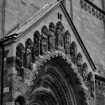 Vintage-style photograph capturing the intricate details of Ják Church's façade in Hungary.